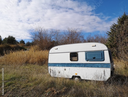 old caravan abandoned in the countryside