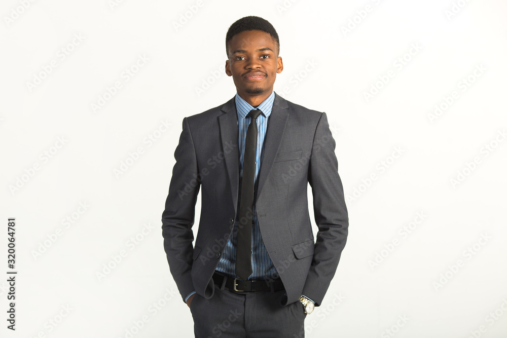 handsome young african man in a suit on a white background handsome young african man in a suit on a white background