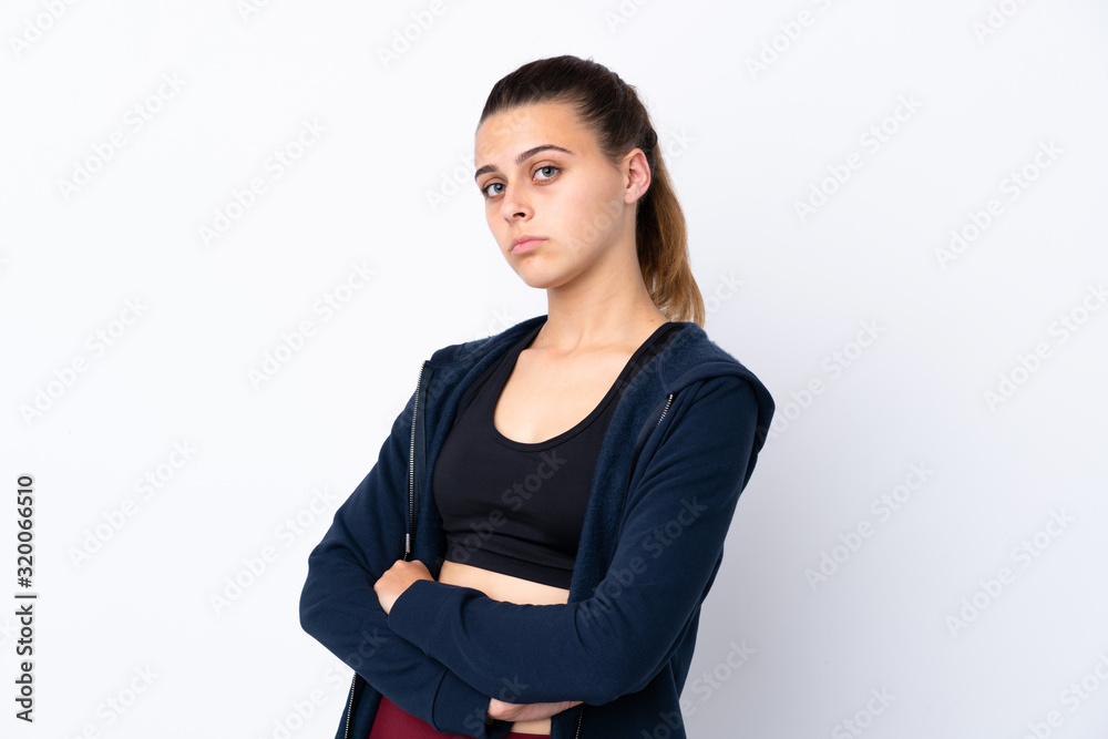 Teenager sport girl over isolated white background keeping the arms crossed Teenager sport girl over isolated white background keeping the arms crossed