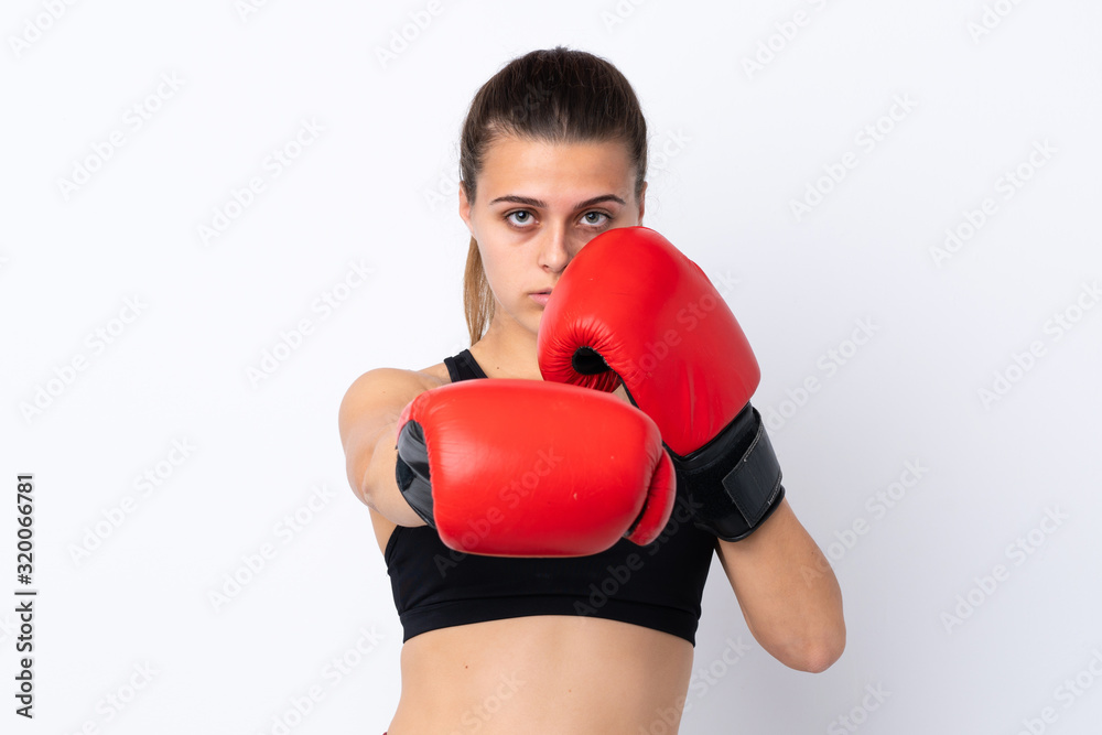Teenager sport girl over isolated white background with boxing gloves Teenager sport girl over isolated white background with boxing gloves