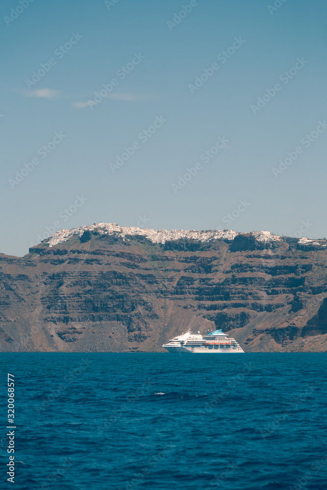 View on the Santroini island harbor and cliffs at sun weather
