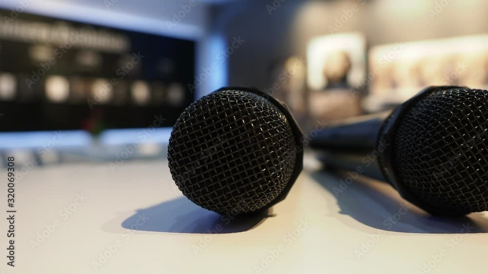 Microphones on white table in the meeting room. Microphones on white table in the meeting room.