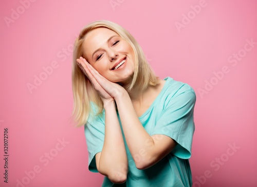 Beautiful smiling woman on pink background