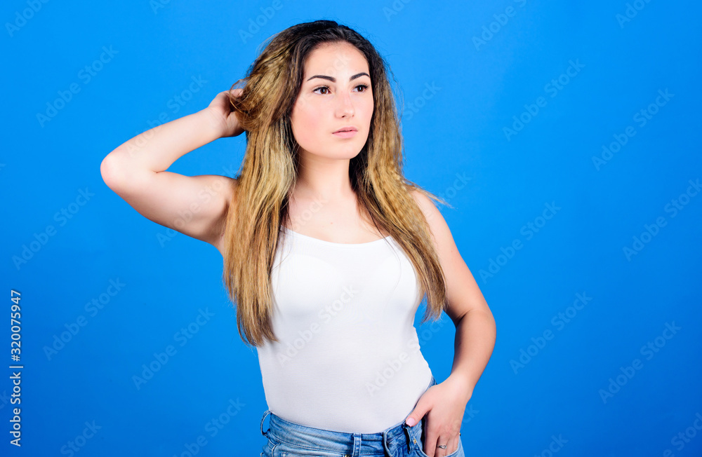 Hair crimping method styling hair becomes wavy. Styling cosmetic product. Hairdresser salon. Damaged hair. Voluminous crimped hair. Crimped hairstyles. Woman stylish hairstyle on blue background Hair crimping method styling hair becomes wavy. Styling cosmetic product. Hairdresser salon. Damaged hair. Voluminous crimped hair. Crimped hairstyles. Woman stylish hairstyle on blue background