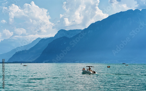 Vevey, Switzerland - August 28, 2016: Ship and people at Geneva Lake in Vevey, Vaud canton of Switzerland. Alps mountains on the background