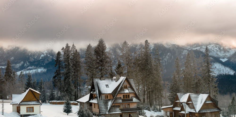 Winter in Tatra Mountains. Views on peeks across mountain houses