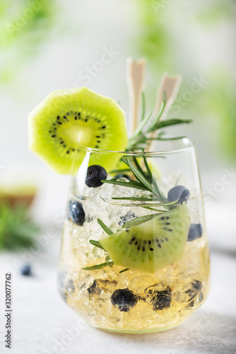 Summer cocktail with kiwi photo