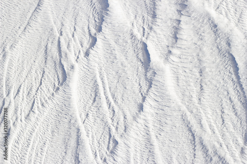 White texture of Pamukkale calcium travertine in Turkey, vertical pattern of the feathers close-up