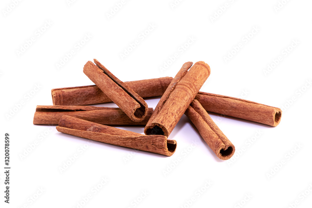 Scattered cinnamon sticks on white background. Isolated. Copy space for text.