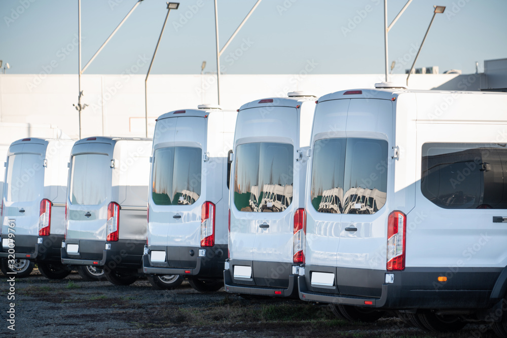 A lot of delivery vans in a row A lot of delivery vans in a row