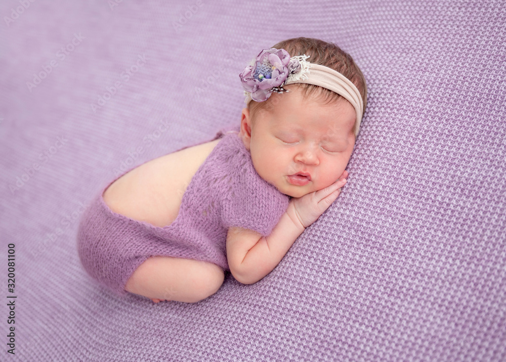 Adorable newborn in knitted suit Adorable newborn in knitted suit