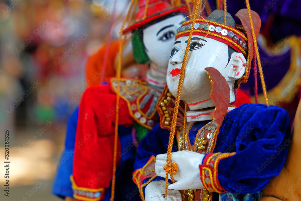 Traditional colorful wooden toy puppets from Mandalay, Myanmar.