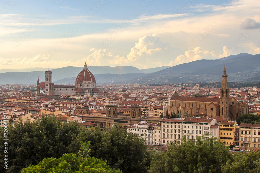 This photo was taken in Florence from Piazza Michelangelo. Visible sights include Basilica of Santa Croce, Cathedral of Santa Maria del Fiore, Museo Galileo and Florence National Central Library.
