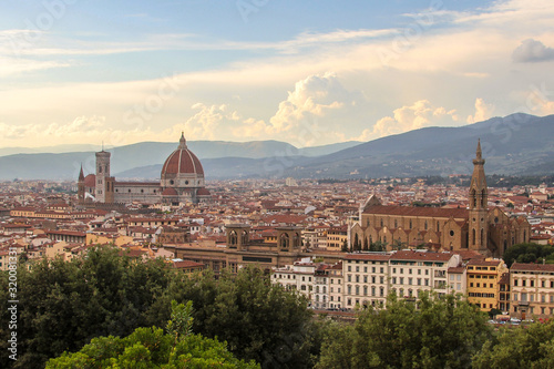 This photo was taken in Florence from Piazza Michelangelo. Visible sights include Basilica of Santa Croce, Cathedral of Santa Maria del Fiore, Museo Galileo and Florence National Central Library.