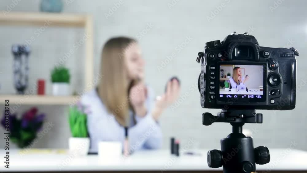 Teenage elegant girl recording her make up tutorial Teenage elegant girl recording her make up tutorial