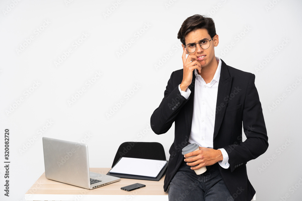 Businessman in his office over isolated white background nervous and scared Businessman in his office over isolated white background nervous and scared