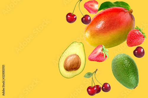 Fototapeta Naklejka Na Ścianę i Meble -  Summer fruits concept background with layout made with mango, cherry, strawberry and avocado. Copy space.