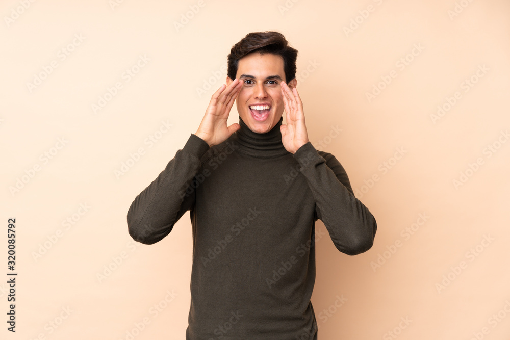 Man over isolated background shouting with mouth wide open Man over isolated background shouting with mouth wide open