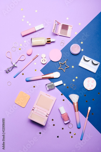 Set of professional decorative cosmetics, makeup tools and accessory on colorful background. Beauty, fashion and shopping concept. Flat lay composition, top view