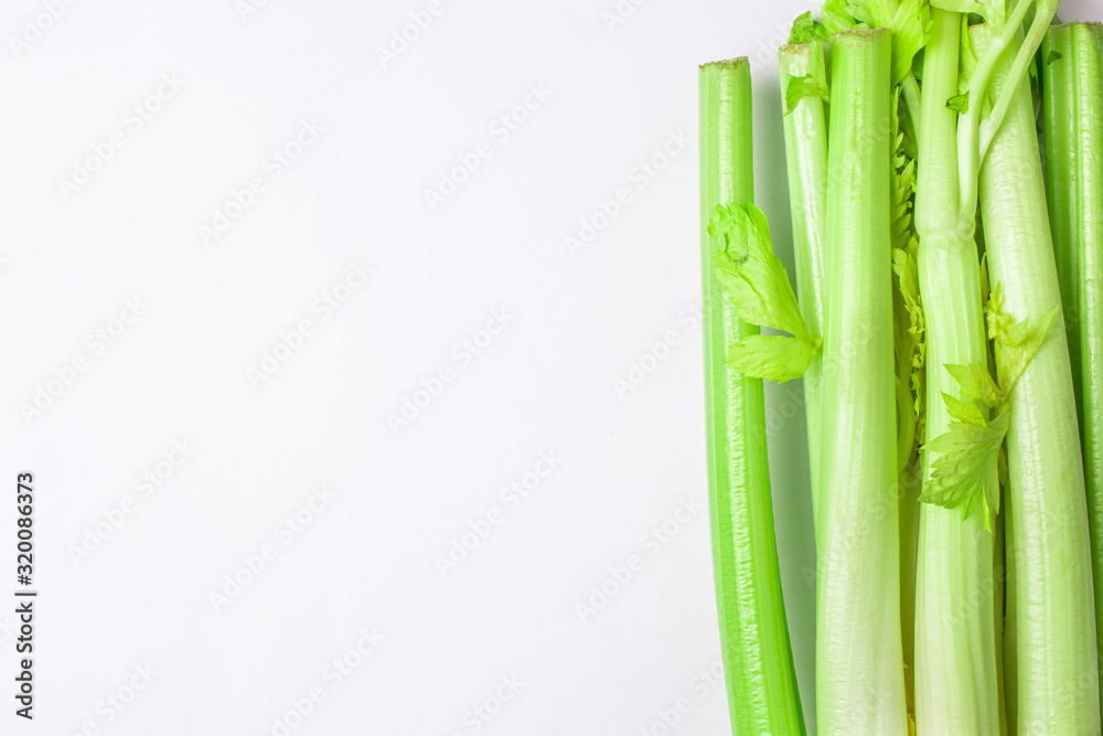 Obraz premium Green celery on white background