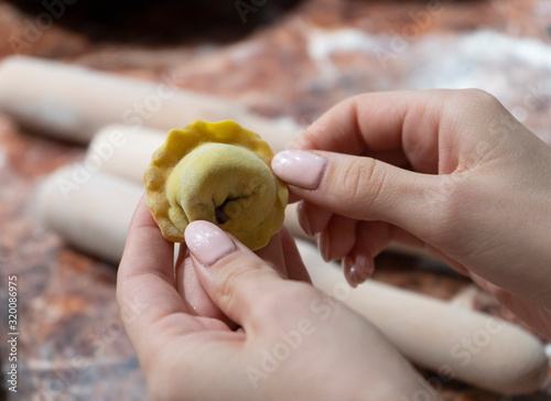 hands holding dumplings