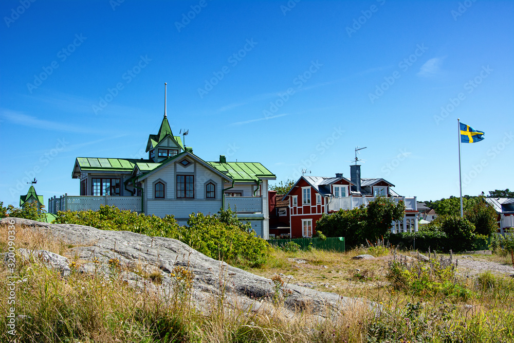 Typical swedish wooden houses on a hill in Sandhamn, Sweden