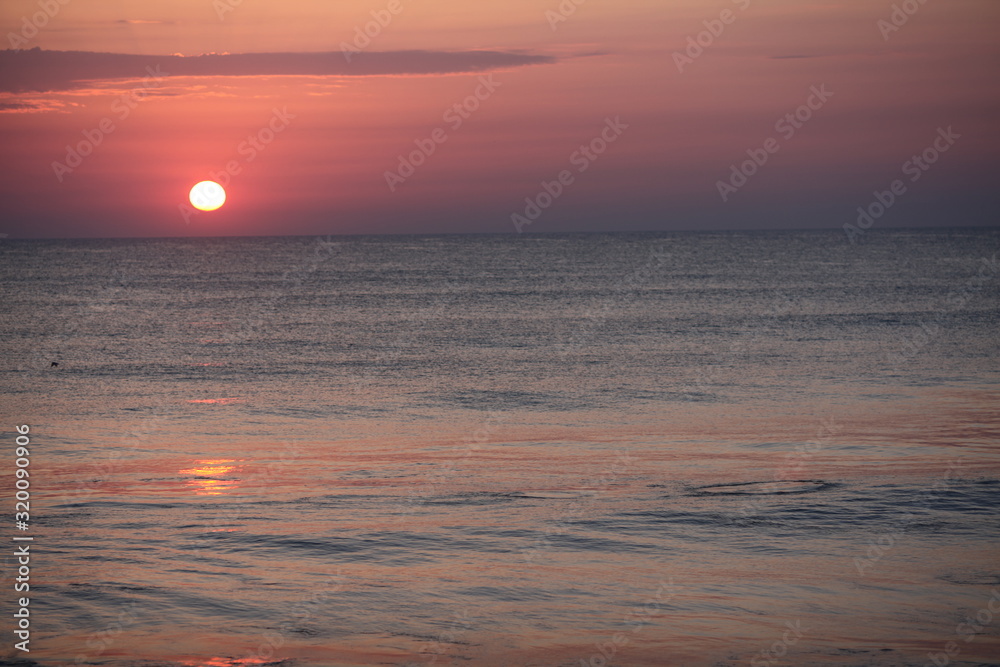 Oramge Sunrise on calm ocean with reflection #4