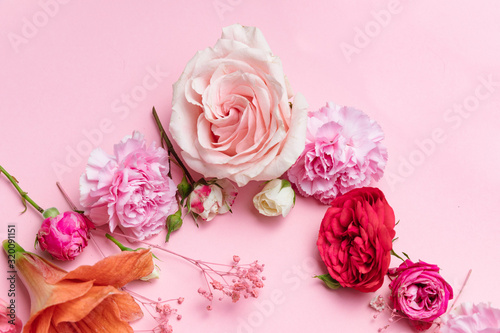 Flowers on pink background. Valentines day background. Mothers day