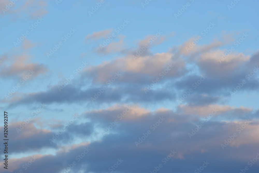 Fototapeta premium winter cloudy sky at sunset