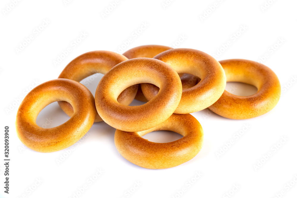 Small dry bagels, small rolls on a white background Small dry bagels, small rolls on a white background