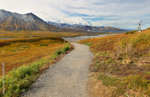 The Denali Mount Peak covered by snow at early morning at Denali National Park. The peak s 20,310-ft.-high Denali (fka Mount McKinley), North America’s tallest peak. Photo shows tundra in foreground photo