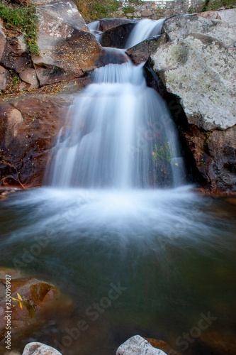 Waterfall of silk water in a river of Extremadura