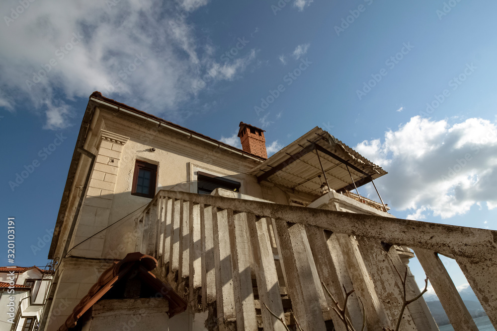 Obraz premium The architecture of the old town. Part of a Renaissance house. Look up. Ohrid, Northern Macedonia.