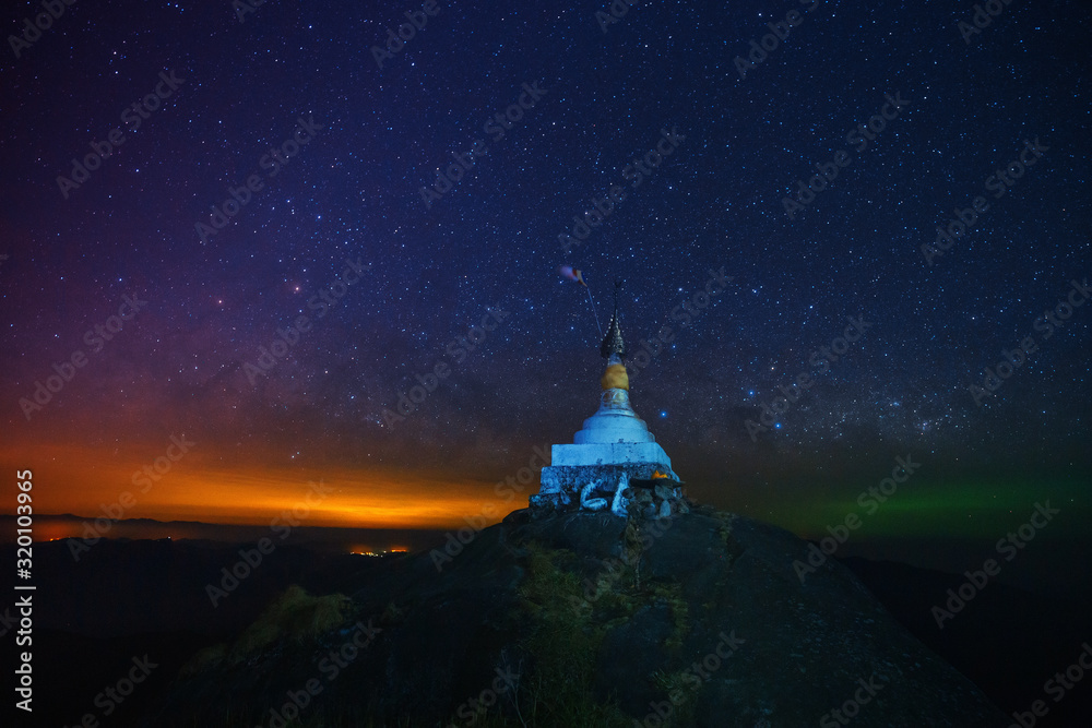 A pagoda on the top of the hill at night