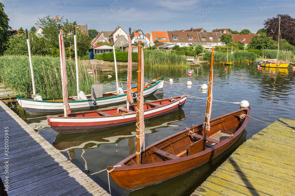Jetty with sailing boats in Holm village of Schleswig, Germany