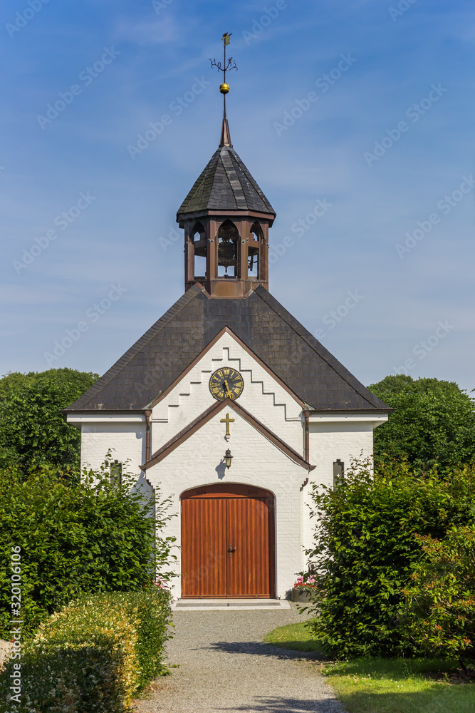 Front of the white chapel in Holm village in Schleswig, Germany