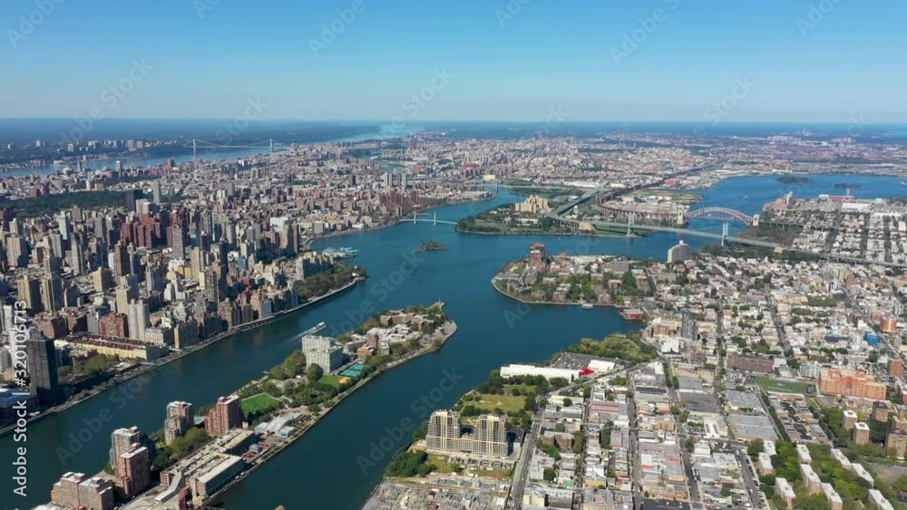 Aerial shot of New York City above East river showing Manhattan Aerial shot of New York City above East river showing Manhattan