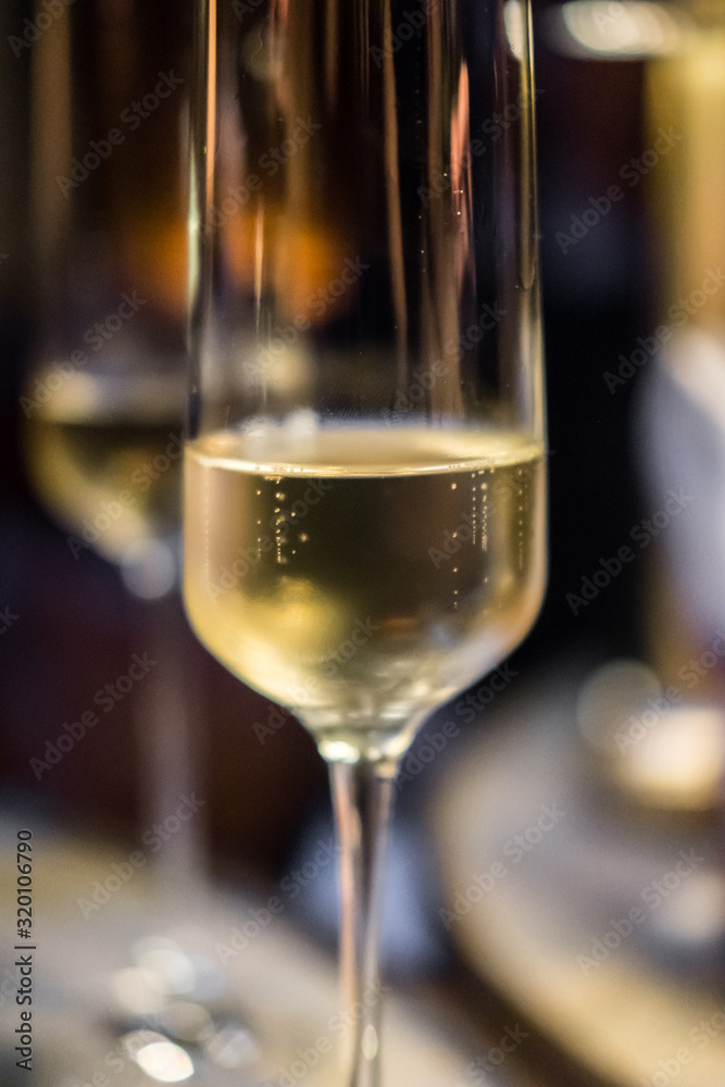 A glass of Champagne on the table A glass of Champagne on the table