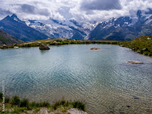 Kreuzboden lake in the canton of Valais southwestern part of Switzerland photo