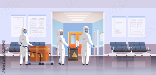 people in protective hazmat suits carrying barrels with warning sign 2019-nCoV flu outbreak china pathogen respiratory MERS-CoV quarantine coronavirus concept hospital interior horizontal vector
