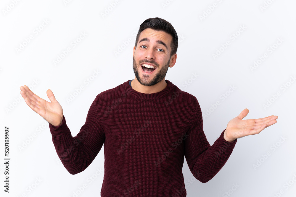 Young handsome man with beard over isolated white background smiling a lot Young handsome man with beard over isolated white background smiling a lot