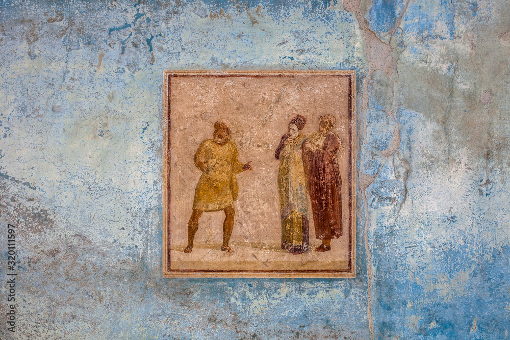 Fresco at the building wall in excavation site of town Pompei, Italy