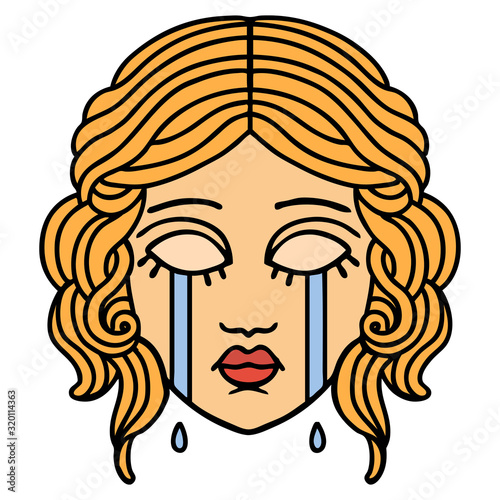 traditional tattoo of female face crying