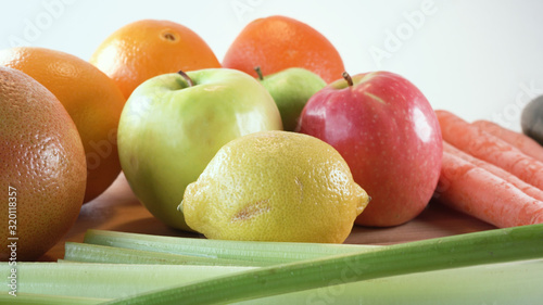 fresh fruits and vegetables on wooden board 