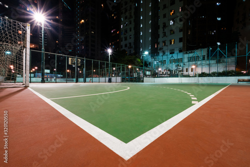 soccer court in city, sports field at night © hanohiki
