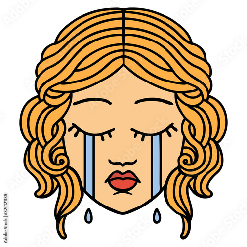 traditional tattoo of female face crying