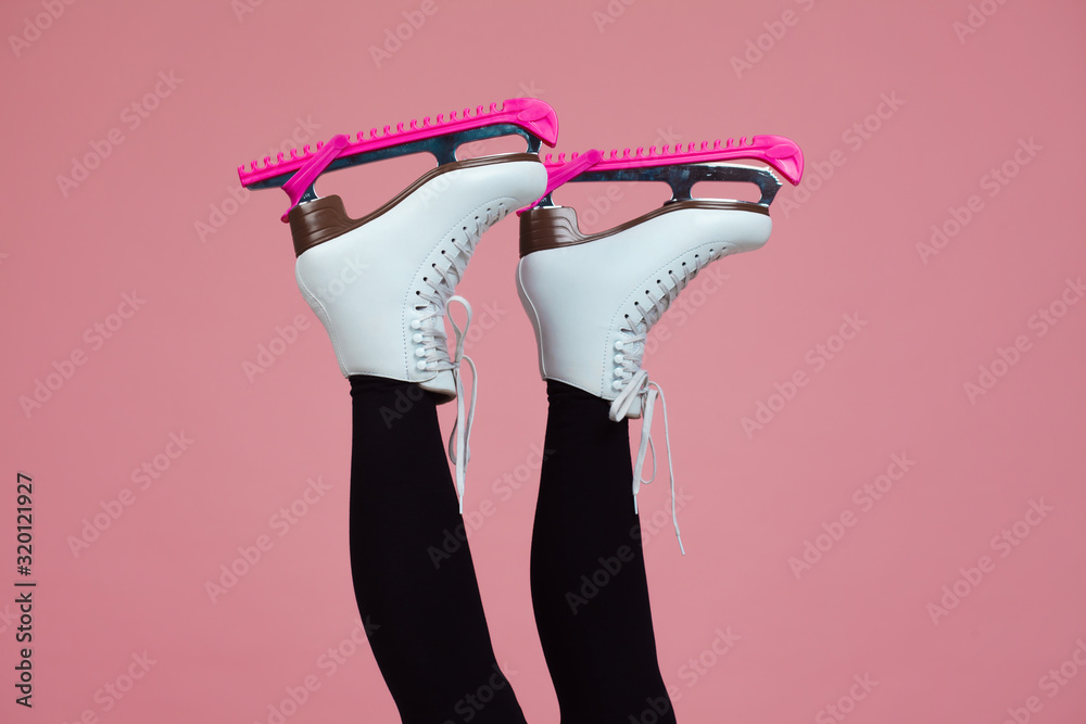 Figure skating is a winter sport and leisure. Women’s feet in ice