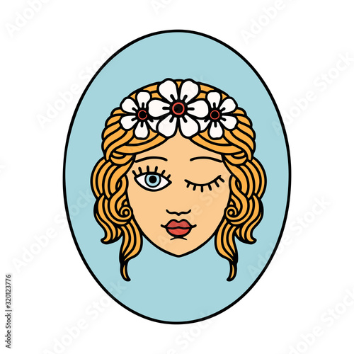 traditional tattoo of a maiden with crown of flowers winking