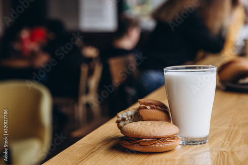 Close up Traditional chocolate and Pumpkin Whoopie pies made with vanilla cream cheese. Background for bakeries, cafes, restaurants photo