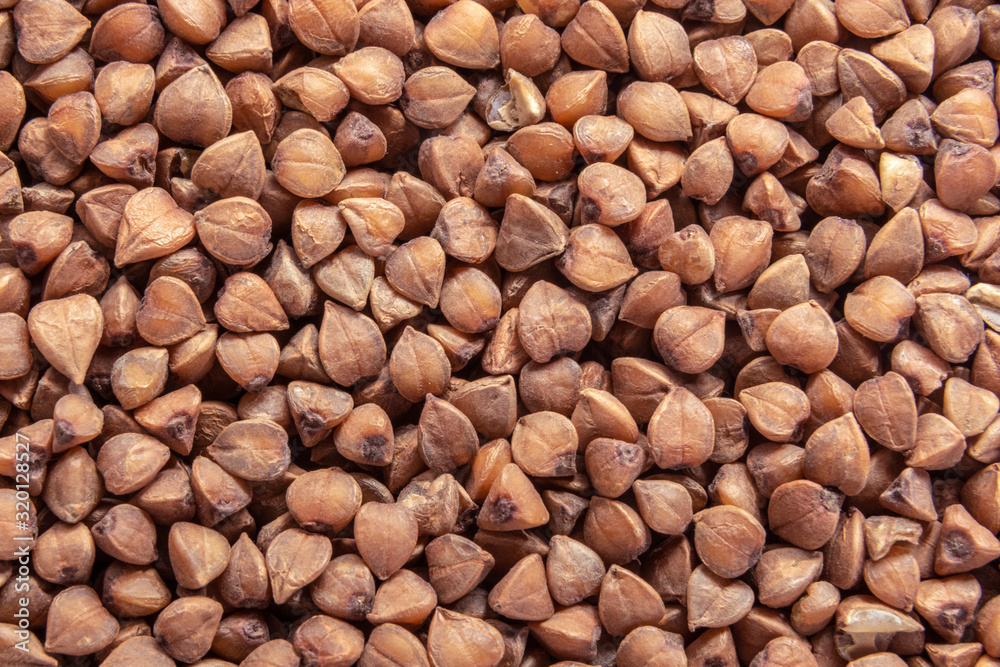 Buckwheat texture. Brown buckwheat groats. Top view, copy space Buckwheat texture. Brown buckwheat groats. Top view, copy space